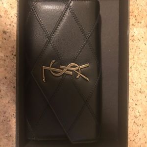 Saint Laurent puffed wallet in black leather.